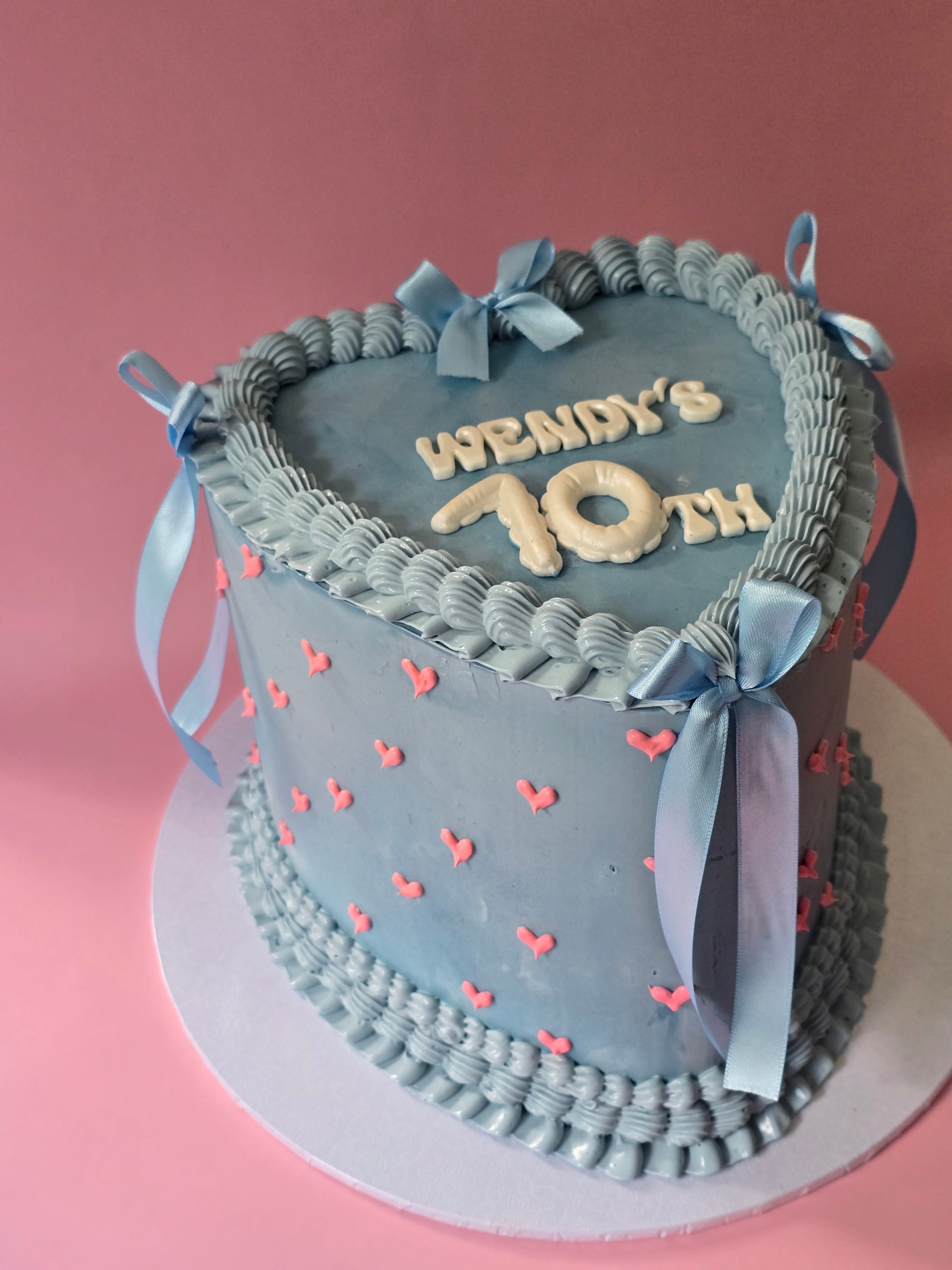 Vintage cake with heart and ribbons