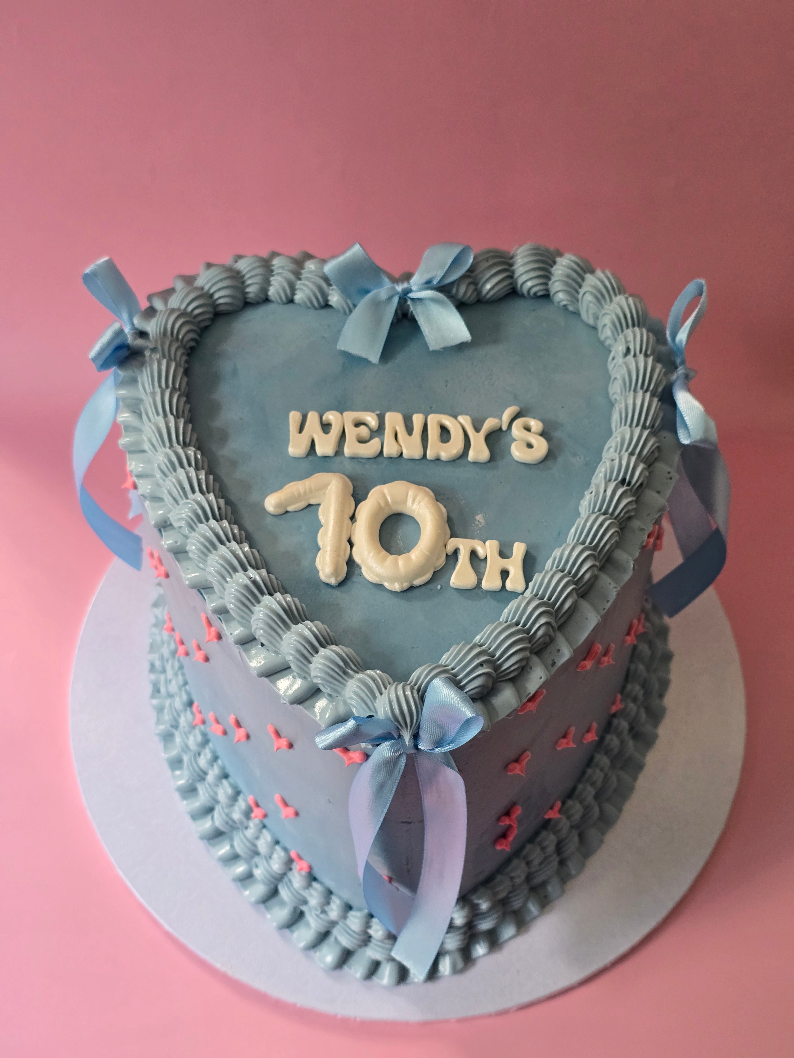 Vintage cake with heart and ribbons