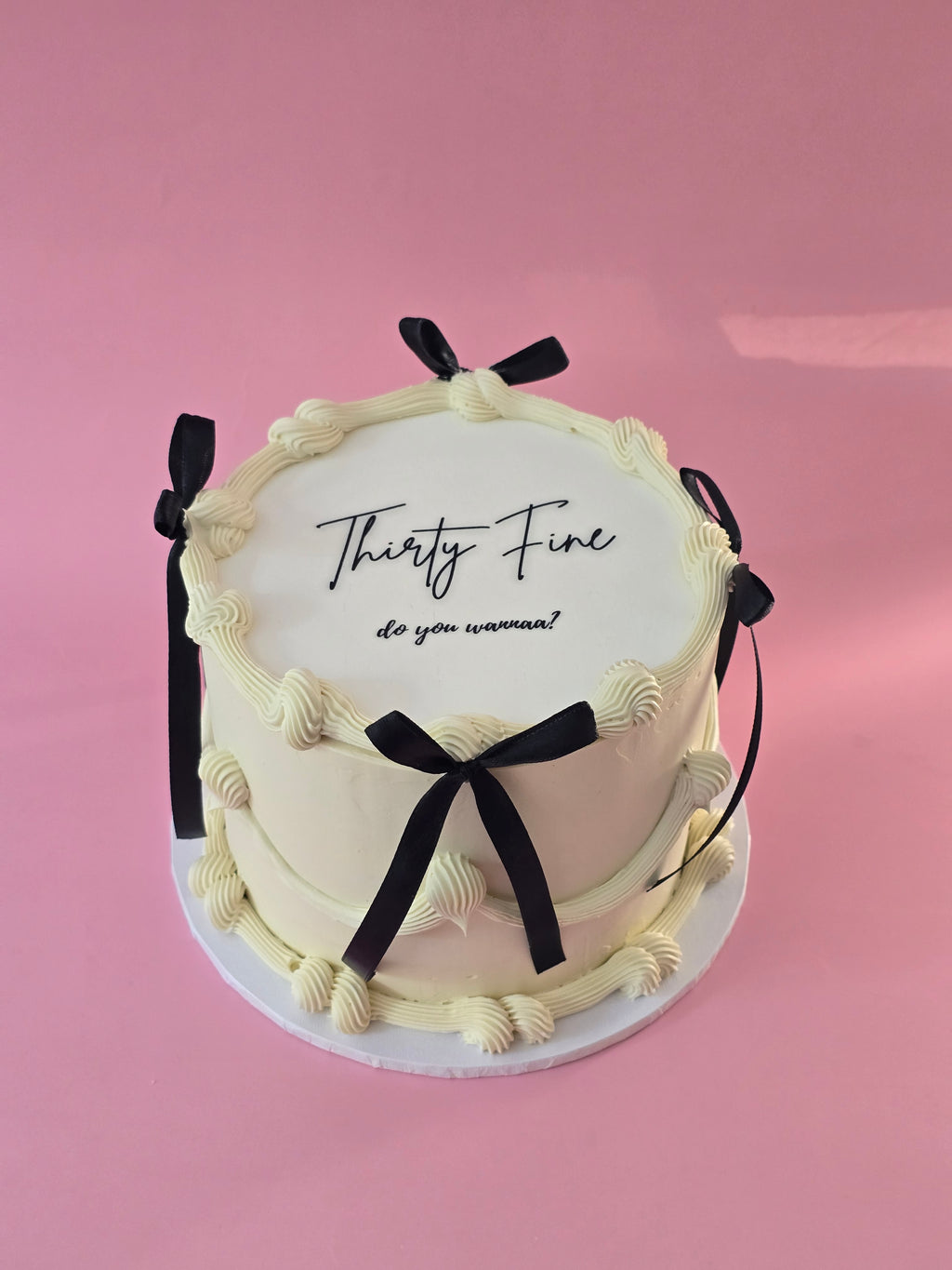 White and black ribbon cake